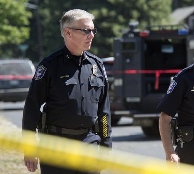 In this Aug. 8, 2015 photo interim Chief Rick Dobrow walks through the shooting scene near the corner of Sanson and Standard. (Dan Pelle / The Spokesman-Review)