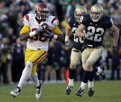Southern California receiver Anthony McCoy races through the Notre Dame defense on a 60-yard gain.   (Associated Press / The Spokesman-Review)