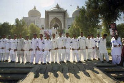 
Security guards from Benazir Bhutto's Pakistan Peoples' Party block the entrance to Garhi Khuda Bux, the Bhutto family burial tomb in Larkana, as they wait for Bhutto's arrival Saturday.Associated Press
 (Associated Press / The Spokesman-Review)