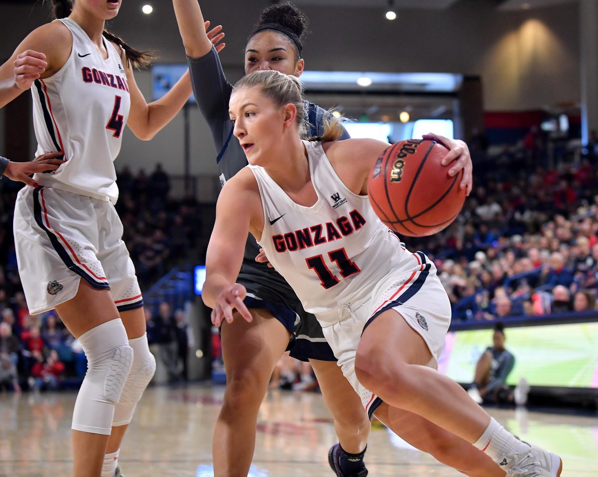 Gonzaga Bulldogs guard Laura Stockton (11) drives the ball against the Loyola Marymount Lions during the first half of a college basketball game on Saturday, March 2, 2019, at McCarthey Athletic Center in Spokane, Wash. (Tyler Tjomsland / The Spokesman-Review)