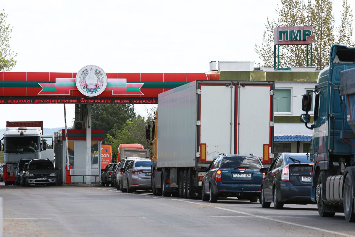 People wait in vehicles to cross the border seen from the Moldovan side of the Varnita-Bender crossing between Moldova and the Moldovan separatist region of Trans-Dniester, Tuesday, April 26, 2022. Police in the Moldovan separatist region of Trans-Dniester say two explosions on Tuesday morning at a radio facility close to the Ukrainian border knocked two powerful antennas out of service just a day after several explosions believed to be caused by rocket-propelled grenades were reported to have hit the Ministry of State Security in the city of Tiraspol, the region's capital.  (Aurel Obreja)