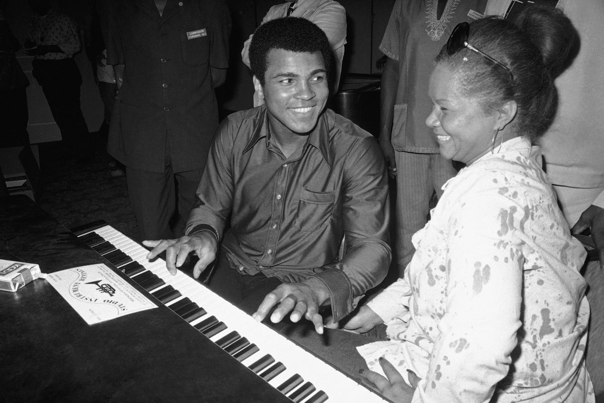 FILE - In this Sept. 22,  1974, photo, Muhammad Ali plays a few notes on the piano as singer Etta James looks on.   The singer