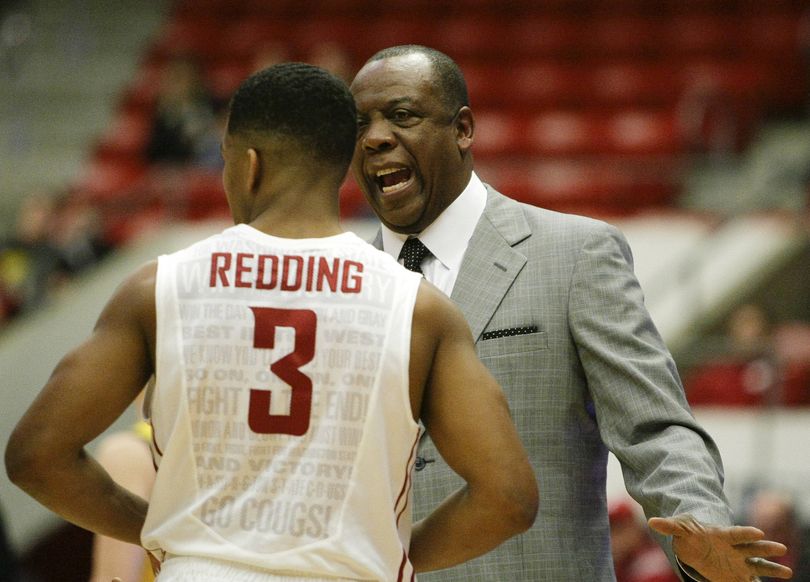 Washington State first-year head coach Ernie Kent talks with guard Ny Redding during a timeout in the California game in January, which the Cougars lost 76-67. (Associated Press)