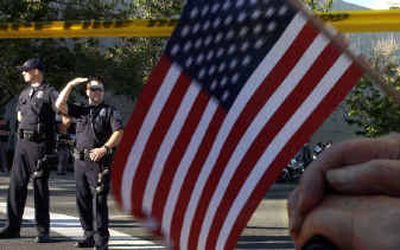 
Police Chief Roger Bragdon says impending city budget cuts could cost his department 30 to 40 positions. During President Bush's visit to Spokane onThursday the department had to spend extra tax dollars to provide security for the event. 
 (Jed Conklin / The Spokesman-Review)