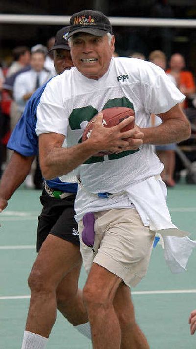 
Joe Kapp takes part in a flag football game before ceremonies at the College Football Hall of Fame. 
 (Associated Press / The Spokesman-Review)