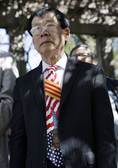 Tam Tran, of Marlton, N.J., wears a tie with the flag of South Vietnam and the Statue of Liberty during ceremonies commemorating the 40th anniversary of Operation Babylift on Saturday. (Associated Press)