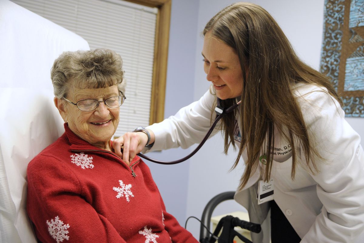 Resident physician Leah Inman performs an evaluation of Marguerite Bergeron at the Internal Medicine Residency Spokane clinic. Inman spent three years in Spokane treating clinic patients and making hospital rounds. She will practice medicine in Gig Harbor, Wash. (Colin Mulvany)