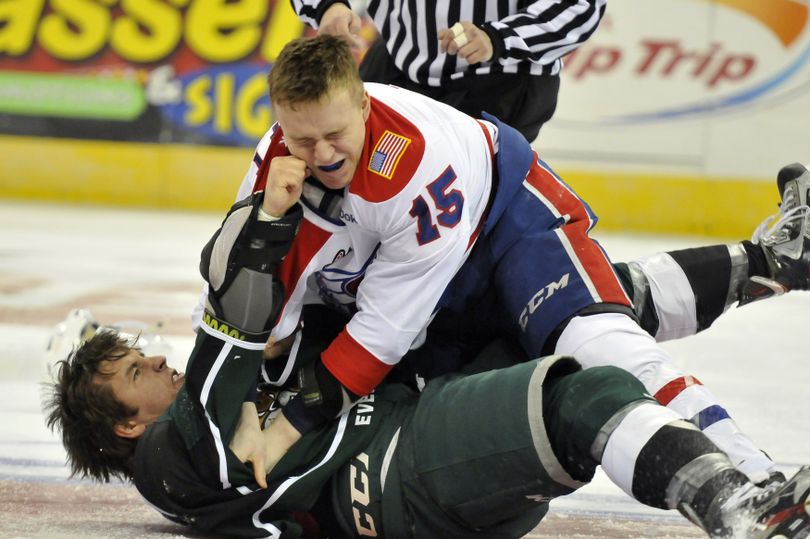 Spokane's Carter Proft, above, tangles with the Everett Silvertips' Landon Oslanski, below, Friday, Mar. 8, 2013 at the Spokane Arena. The Chiefs beat Everett 6-3. (Jesse Tinsley / The Spokesman-Review)