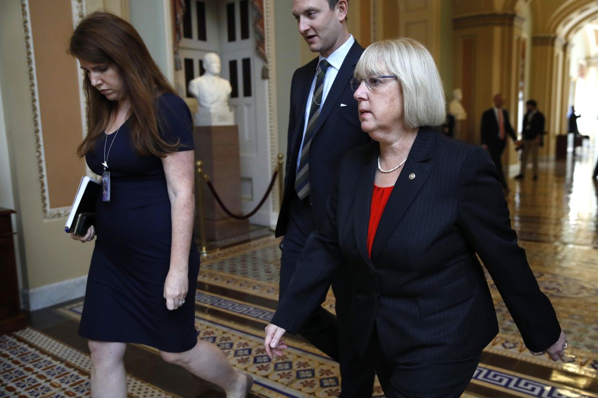 Sen. Patty Murray, D-Wash., right, walks through the Capitol, Dec. 1, 2017, on Capitol Hill in Washington. (Jacquelyn Martin / AP)