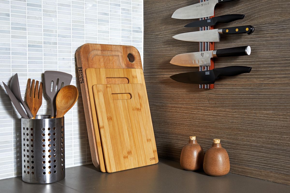 Save counter space by storing knives on a magnetic strip, rather than in a knife block, and by leaning cutting boards against the backsplash, where the wood can create visual warmth. (Stacy Zarin Goldberg / Stacy Zarin Goldberg/Washington Post)