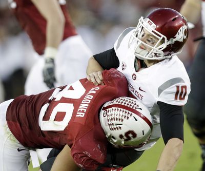 Former WSU QB Jeff Tuel felt the wrath of Ben Gardner and Stanford last season when he was sacked 10 times. (Associated Press)