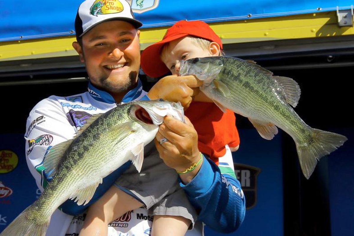 Joey Nania, 25, a native of Liberty Lake, Washington, is in his sixth year of fishing professional open bass tournaments in 2016. He is also the co-host of Sweetwater Fishing TV and maintains a steady fishing guide business in Alabama. He is shown here at a tournament weigh-in with his son, Zeke. (Courtesy photo)