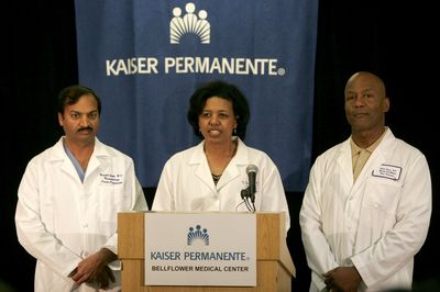 Drs. Mandhir Gupta, left, Karen Maples and Harold Henry discuss the condition of the octuplets born on Monday. Seven of the babies were breathing unassisted.  (Associated Press / The Spokesman-Review)