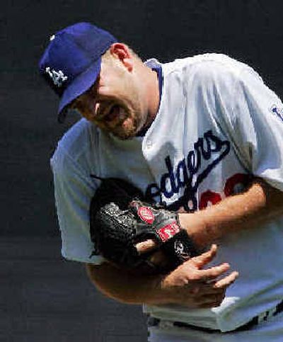 
Los Angeles Dodgers pitcher Brad Penny grimaces after throwing a pitch during the first inning on Sunday. 
 (Associated Press / The Spokesman-Review)