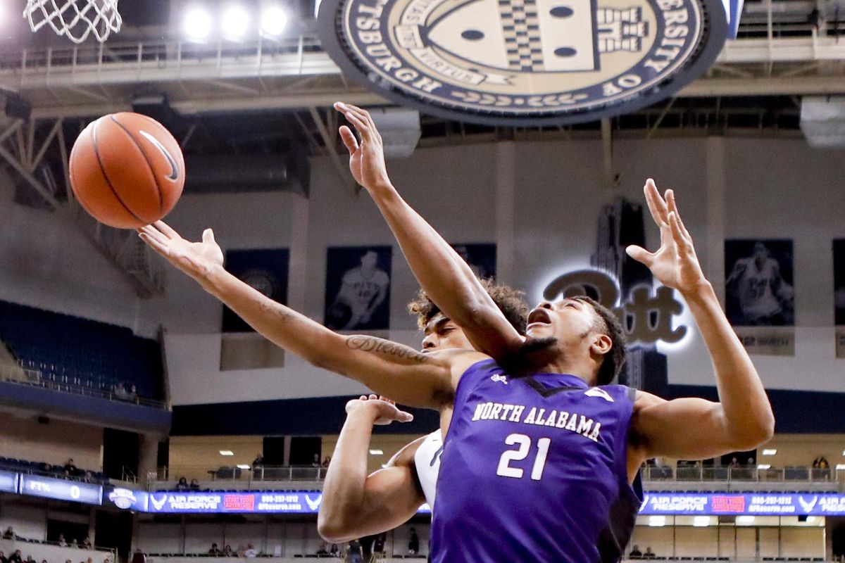 North Alabama’s Emmanuel Littles  reaches for a rebound on a shot by Pittsburgh’s Malik Ellison during the first half  Nov. 17  in Pittsburgh. (Keith Srakocic / AP)