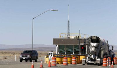 
Vehicles go through the Wye Barricade checkpoint at Hanford on Wednesday, where a suspected container leak caused the evacuation of some workers. 
 (Associated Press / The Spokesman-Review)