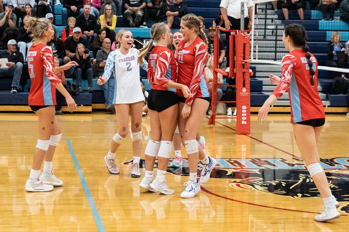 Freeman players celebrate winning the second set against visiting Riverside during a Northeast 1A League match on Thursday.  (Madison McCord/For The Spokesman-Review)