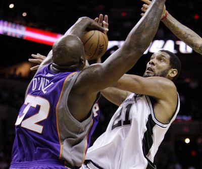 Phoenix’s Shaquille O’Neal blocks a shot by the Spurs’ Tim Duncan during the first half of the visiting Suns’ 103-98 victory in San Antonio.  (Associated Press / The Spokesman-Review)