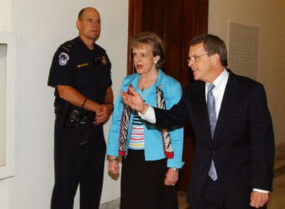 Sen. Mike DeWine, R-Ohio, escorts Supreme Court nominee Harriet Miers to his office for a meeting Wednesday.
(Associated Press / The Spokesman-Review)