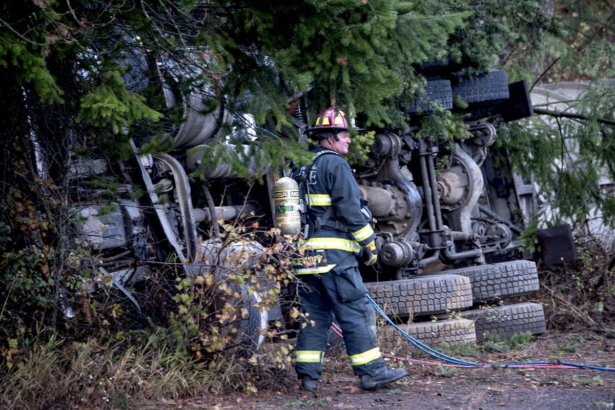 Northern Lakes Fire Protection District Capt. Fritz Wiedenhoff was on the scene this of a semitruck that rolled near U.S. Highway 95 and Boekel Road in Hayden, Idaho, on Oct. 5, 2016. The fire district is asking voters in the November 2024 election for a tax to maintain its staffing and stations.  (Kathy Plonka/The Spokesman-Review)