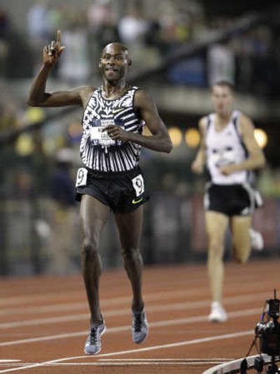 Former Washington State University runner Bernard Lagat signals his victory in the men's 5,000-meter final.Associated Press
 (Associated Press / The Spokesman-Review)