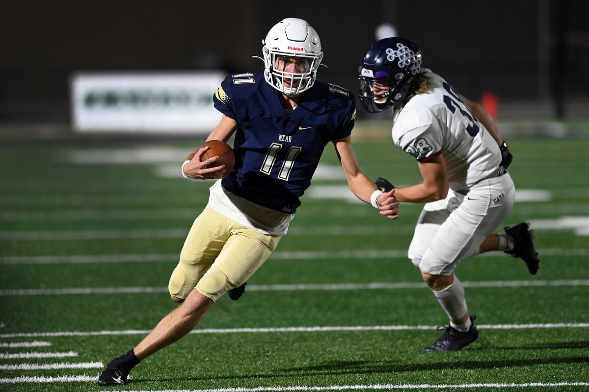 Mt. Spokane slot Blake Spear runs for a 52-yard touchdown in the second quarter Friday to give the Wildcats a 10-3 lead over Mead during the annual Battle of the Bell at Union Stadium in Mead.  (Colin Mulvany/THE SPOKESMAN-REVIEW)