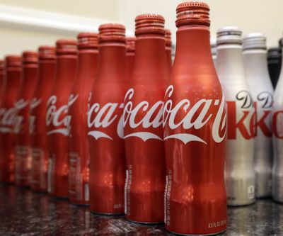 Coca-Cola, which struggles with declining soda consumption in the U.S., is working with fitness and nutrition experts who suggest smaller portions of its cola as a healthy treat. (Associated Press)