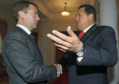 Venezuelan President Hugo Chavez, right, shakes hands with Russian President Dmitry Medvedev in Russia on Friday.  (Associated Press / The Spokesman-Review)