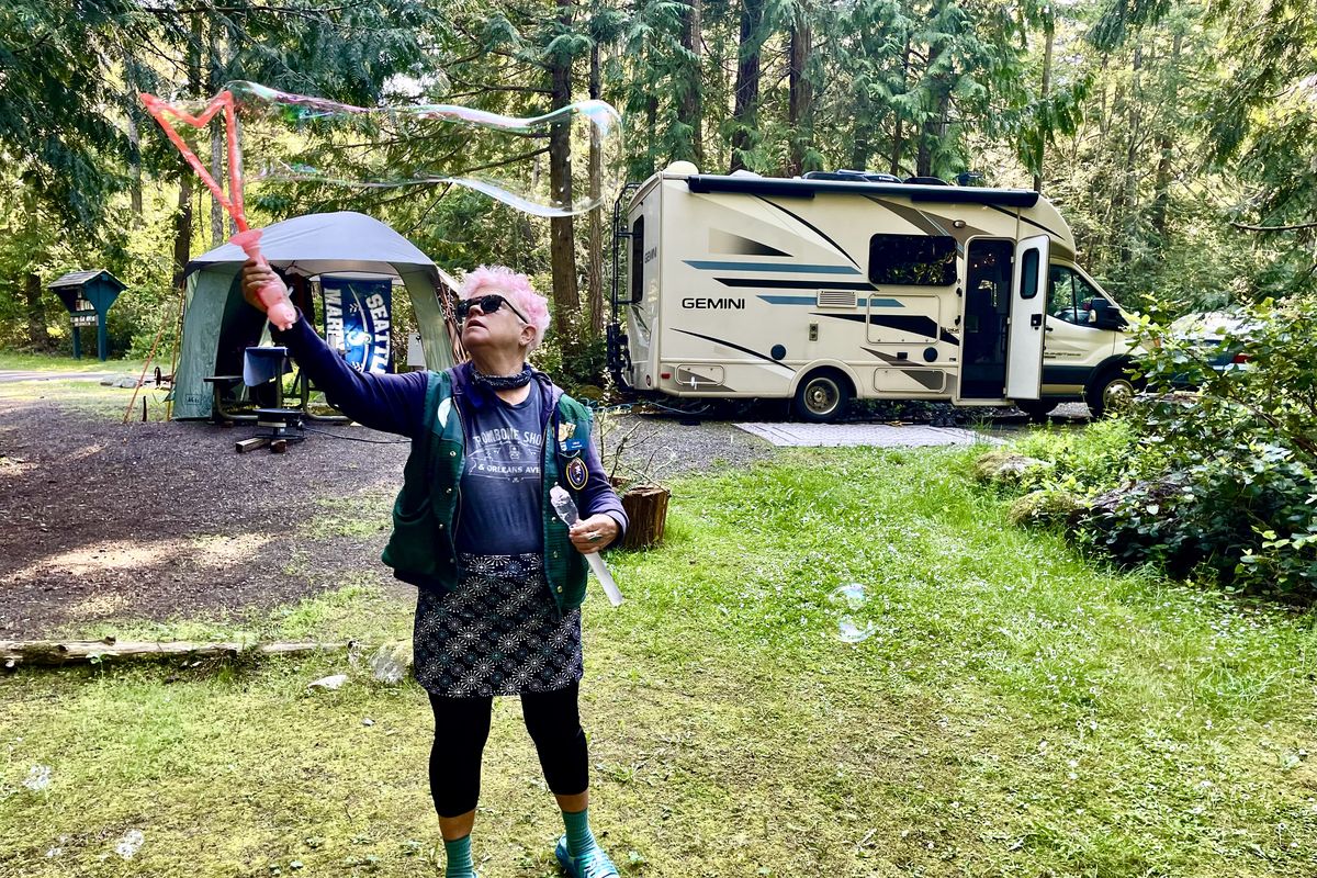 Leslie’s summer campsite activities include creating bubbles. (John Nelson)