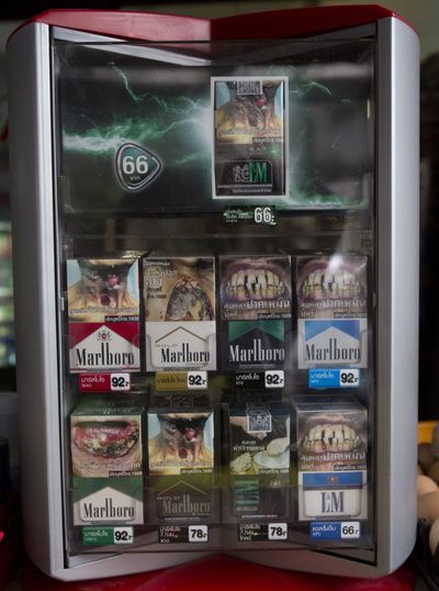 Packs of cigarettes are displayed for sale at a shop Friday in Bangkok. (Associated Press)