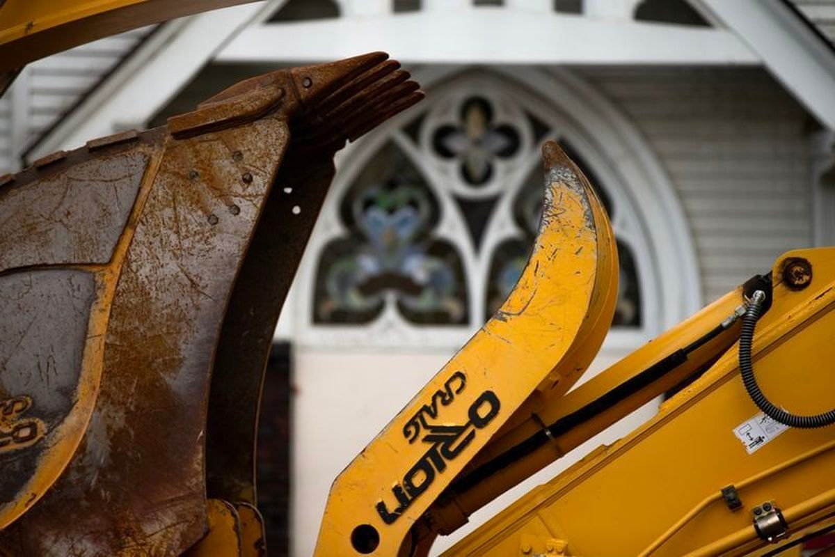 The former Portland Korean Church, originally constructed in 1905, was demolished on Friday after a fire gutted it earlier in the week. (Dave Killen/Oregonian)