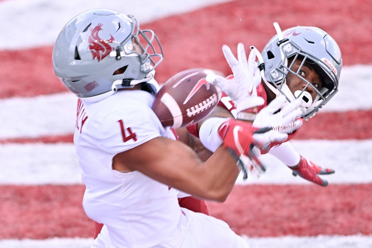 Washington State Cougars defensive back Warren Smith Jr. (22) breaks up a pass in the end zone intended for wide receiver Tsion Nunnally (4) during WSU’s Crimson and Gray spring football game on Saturday, April 22, 2023, at Gesa Field in Pullman, Wash.  (Tyler Tjomsland/The Spokesman-Review)