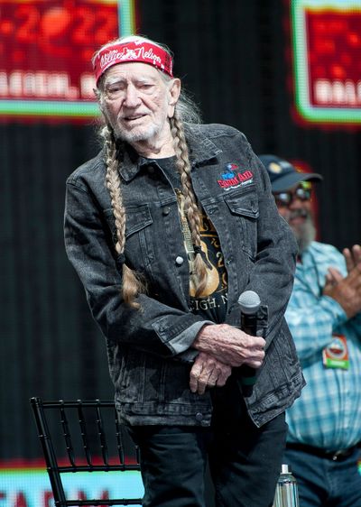 Musician Willie Nelson gets ready to perform at the 2022 Farm Aid benefit concert at the Coastal Credit Union Music Park in Raleigh, N.C.  (Tribune News Service)