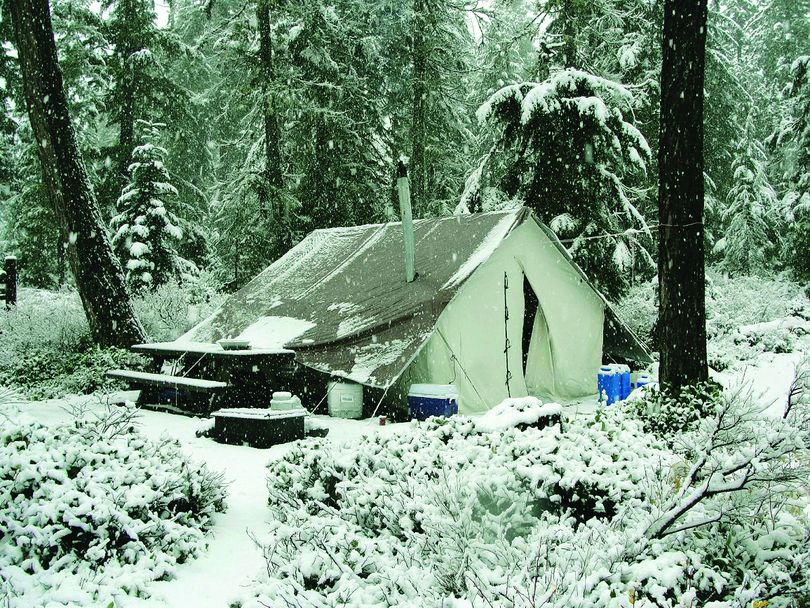 This photo of an elk camp near Mount St. Helens won the Washington Department of Fish and Wildlife Contest to appear on the cover of the 2014 Big-Game Hunting Seasons & Regulations pamphlet. (Jason Raines)