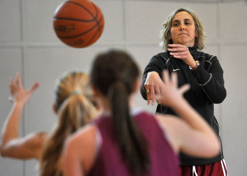 Whitworth women's basketball coach Helen Higgs works with her players on post moves during practice on Monday. (Dan Pelle / The Spokesman-Review)