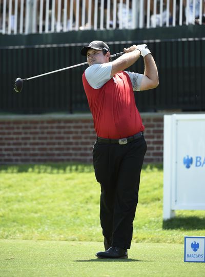 Patrick Reed tees off during the second round of The Barclays. (Kathy Kmonicek / Associated Press)