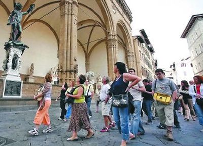 A group of tourists look at the bronze statue of Perseus by 16th century sculptor Benvenuto Cellini in Florence's Piazza della Signoria. Florence, along with Rome and Venice, are can't-miss Italian destinations.
(Associated Press / The Spokesman-Review)