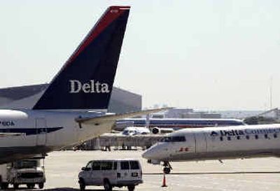 
Delta plans to cut its most expensive fares and cut some overnight-stay requirements.
 (Associated Press / The Spokesman-Review)