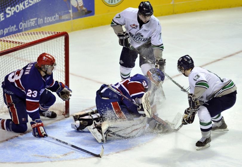 Spokane Chiefs goaltender Mac Engel takes a face full of ice as he stops a goal attempt by Seattle Thunderbirds' Tyler Alos (13) in the first period in game played on Friday, March 18, 2011 in the Spokane Arena. (Colin Mulvany / The Spokesman-Review)