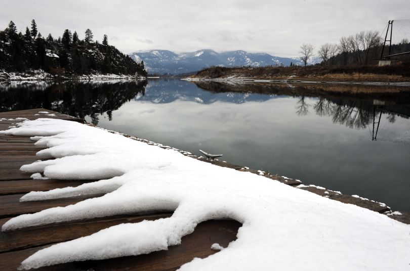 The remains of a recent snowfall cling to the docks at a boat launch on the Kootenai River in Bonners Ferry on Thursday. (Kathy Plonka)