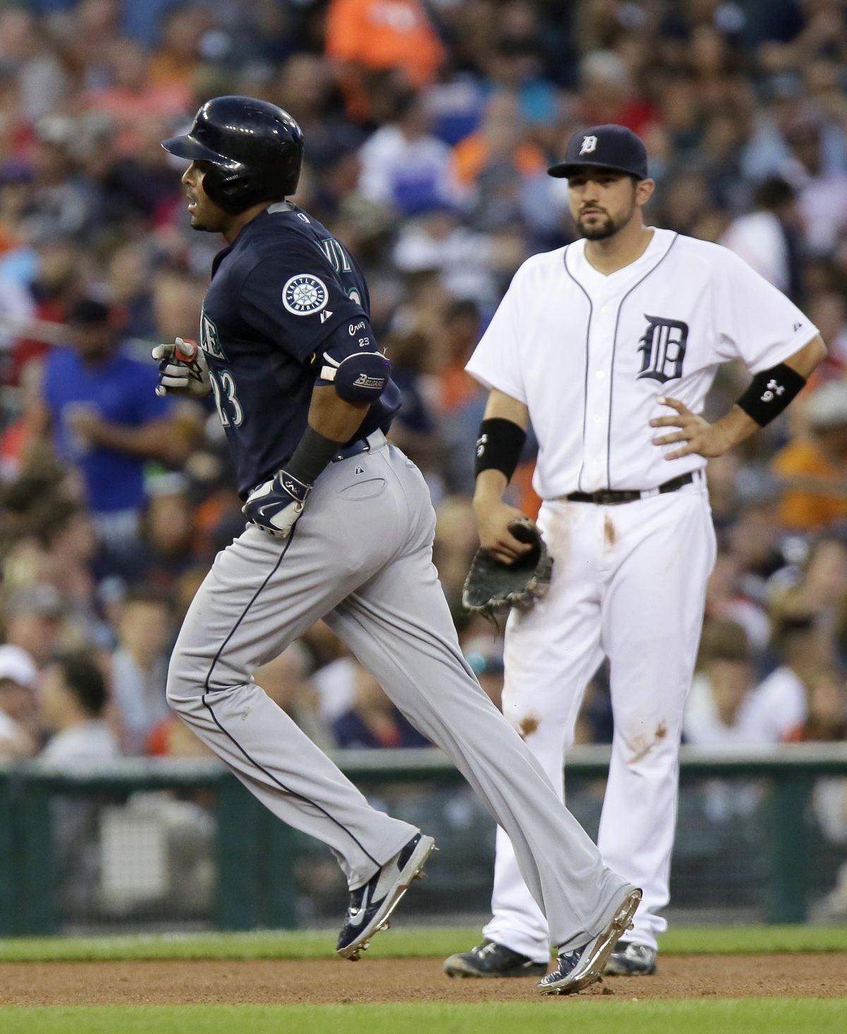 Seattle’s Nelson Cruz, left, rounds the bases after hitting second home run of game against Detroit. (Associated Press)