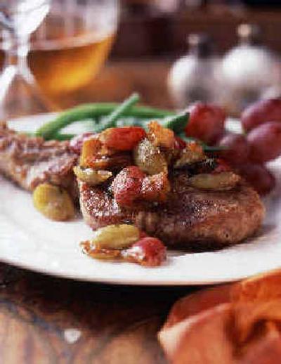 
Pork Chops with Fruit Topping takes advantage of fresh fruit now available.
 (Associated Press / The Spokesman-Review)