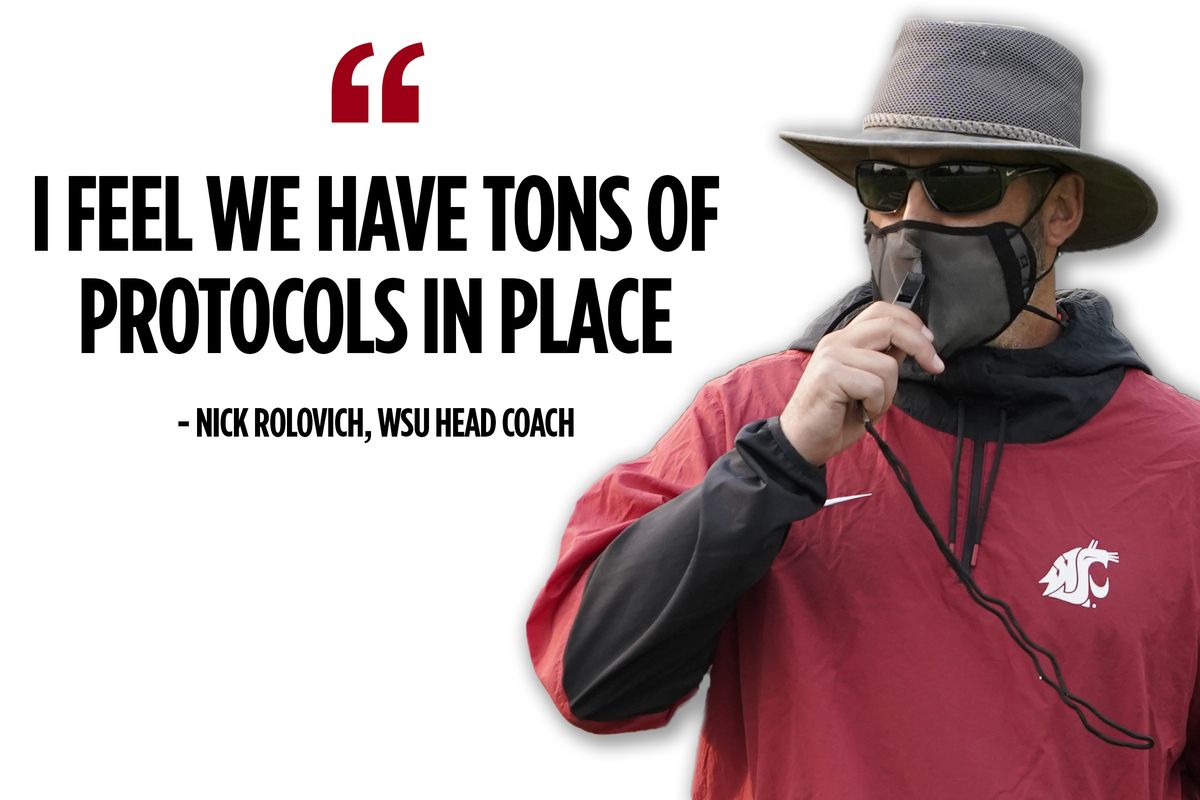 Washington State head coach Nick Rolovich brings up his whistle but finds it is blocked by his mask as he works with players during first day of NCAA college football practice, Friday, Aug. 6, 2021, in Pullman, Wash.  (Associated Press)
