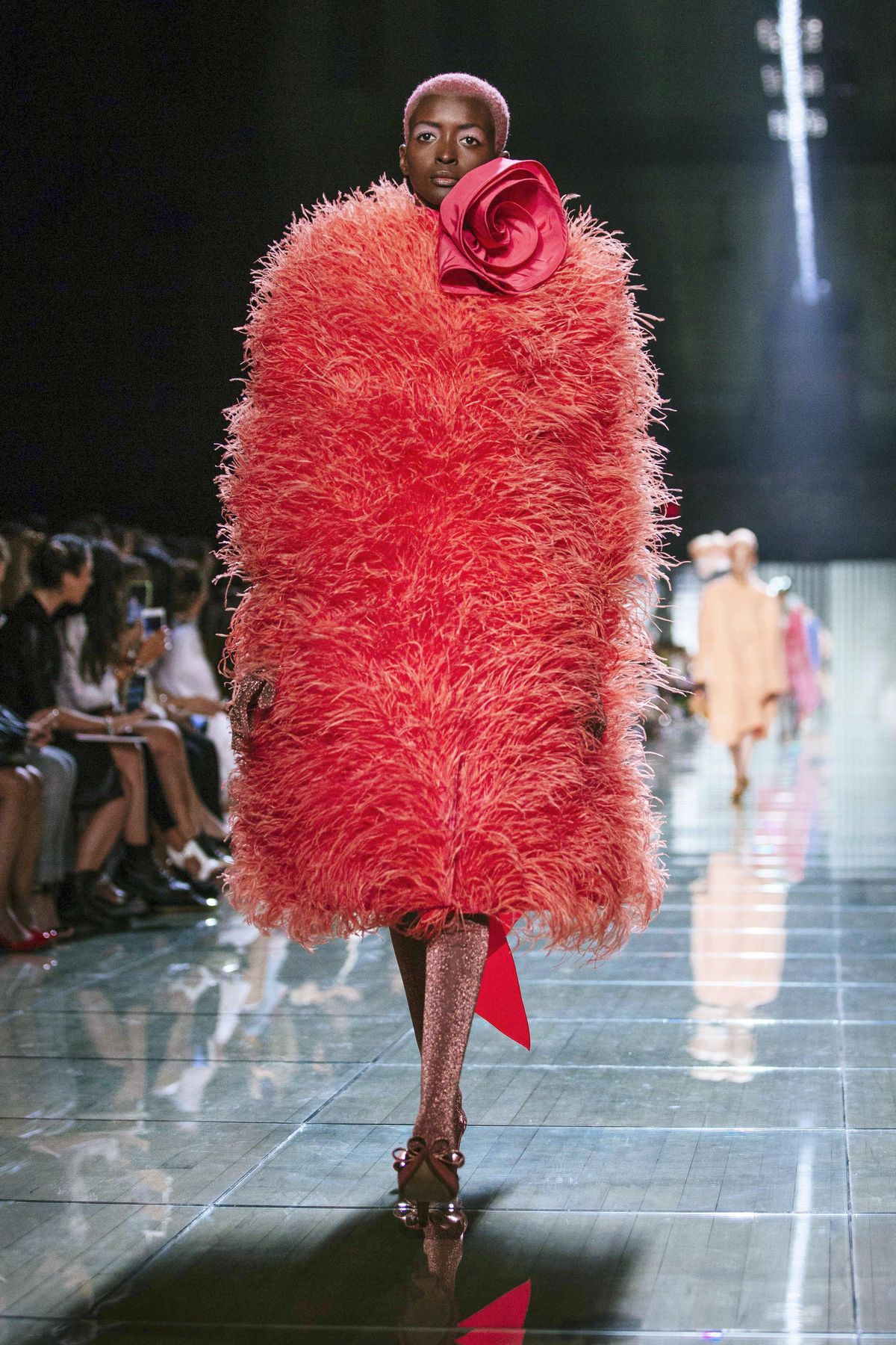 A model wearing a coral outfit from the Marc Jacobs spring 2019 collection walks the runway Sept. 12, 2018, during Fashion Week in New York. Pantone Color Institute has chosen the color Living Coral as its 2019 color of the year. (Kevin Hagen / AP)