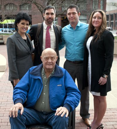 Rhonda Lee Firestack-Harvey, left, Jason Zucker, Rolland Gregg and Michelle Gregg stand with Larry Harvey outside the Thomas S. Foley United States Courthouse on Thurday, Feb. 12, 2015, in Spokane, Wash. A federal judge will decide whether the criminal case against the Kettle Falls Five will take place later this month. (Dan Pelle / The Spokesman-Review)