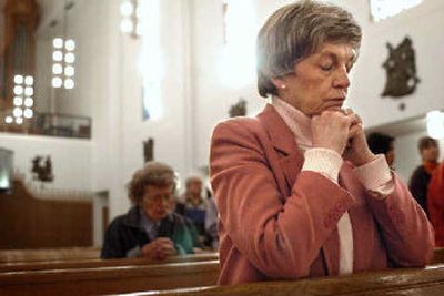 
Catholic Charities director Donna Hanson, shown here praying at St. Augustine Catholic Church, died Friday after a battle with cancer. A vigil service will take place at 7 p.m. on Tuesday at Our Lady of Lourdes Cathedral. 
 (File/ / The Spokesman-Review)