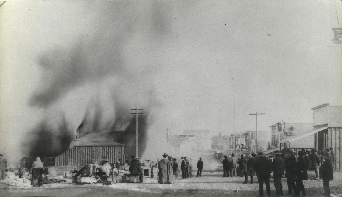 1889: This is one of the few photos in existence of the great Spokane fire of Aug. 4, 1889. This view looks north on Howard Street from Railroad Avenue, about one block east of where the fire started. The street was cluttered with furniture and goods that had evidently been cleared from the buildings that stood in the fire
