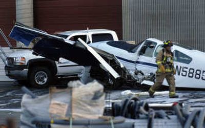 
A twin-engine airplane crashed and hit a pickup in Kootenai County on Monday near the Kootenai Electric office close to Coeur d'Alene Airport/ Pappy Boyington Field. 
 (Kathy Plonka / The Spokesman-Review)