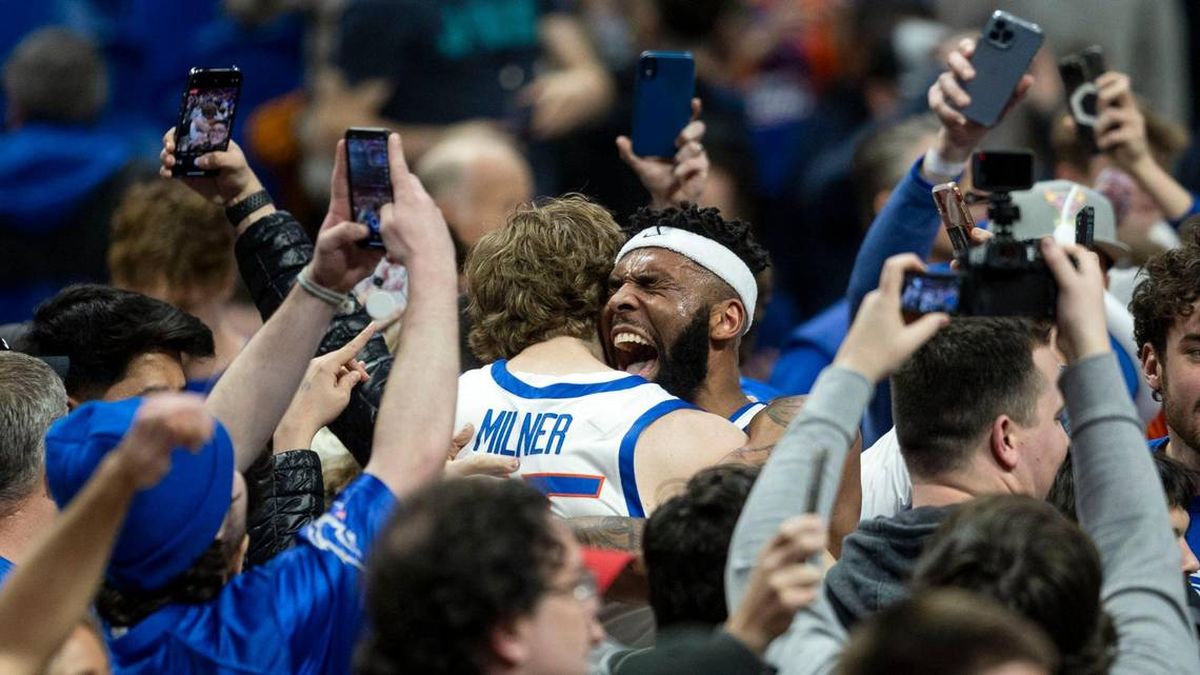 Boise State forward Naje Smith gives an emotional hug to fellow senior Lukas Milner after the Broncos win their final home game 66-60 against Mountain West foe San Diego State at ExtraMile Arena in Boise in February.  (Tribune News Service)