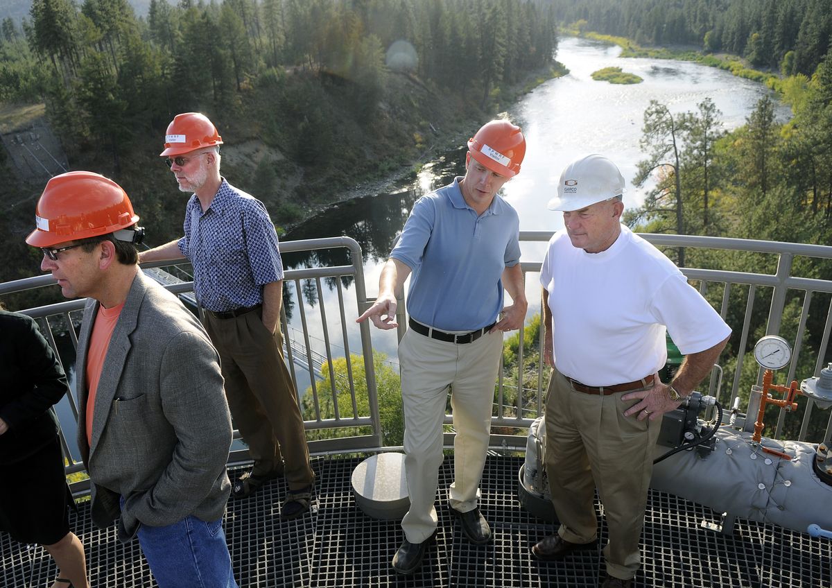 From left, Dale Arnold and  Lars Hendron, of the city of Spokane, and Hollis Barnett and Tim Welsh,  of Garco Construction, take a tour Tuesday atop the new digester at the wastewater treatment plant on Aubrey L. White Parkway. (Photos by Dan Pelle / The Spokesman-Review)